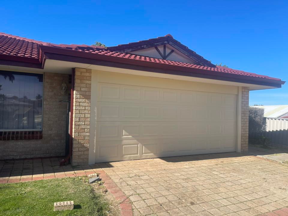Mandurah Garage Door Repairs residential double sectional garage door on a brick home driveway